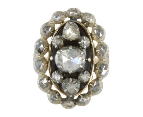 AN ANTIQUE DIAMOND AND BLUE GLASS DRESS RING in high carat yellow gold, probably French, set with a central rose cut diamond 