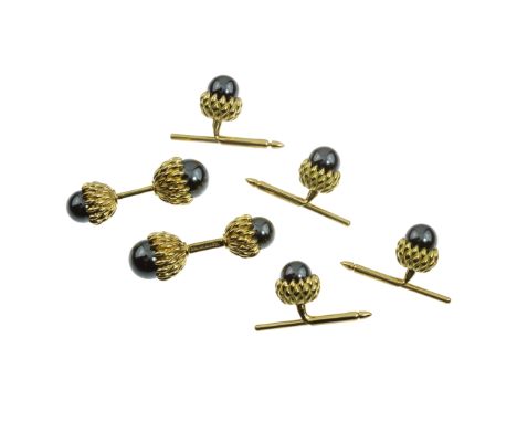 A HEMATITE ACORN CUFFLINKS AND SHIRT STUD DRESS SET, SCHLUMBERGER, TIFFANY &amp; CO in 18ct yellow gold, comprising a pair of