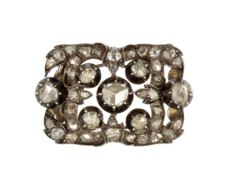 AN ANTIQUE ROSE CUT DIAMOND CLASP in high carat yellow gold and silver set with a central rose cut diamond of 6.3mm, surround
