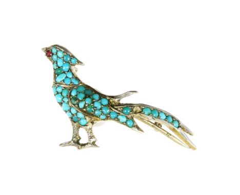 AN ANTIQUE TURQUOISE AND RUBY BIRD BROOCH in silver, designed as a bird, in profile, its body jewelled with turquoise beads, 