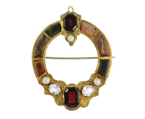 AN ANTIQUE SCOTTISH HARDSTONE, AQUAMARINE, PEARL AND GARNET BROOCH in high carat yellow gold, the circular motif jewelled at 