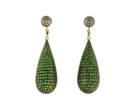 A PAIR OF TSAVORITE GARNET AND DIAMOND DROP EARRINGS in gold and silver, each designed as a large, tapering briolette drop je