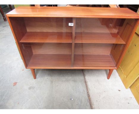 A mid Century glass fronted teak cabinet, bi-seated with single height adjustable shelf in each section. 107 x 27 d x 78cm ta