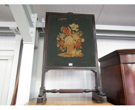 A 19th Century needlepoint mahogany fire screen  