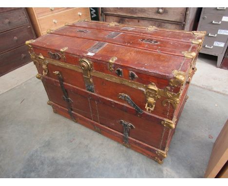 A Victorian coaching trunk, oak bound with metal mounts