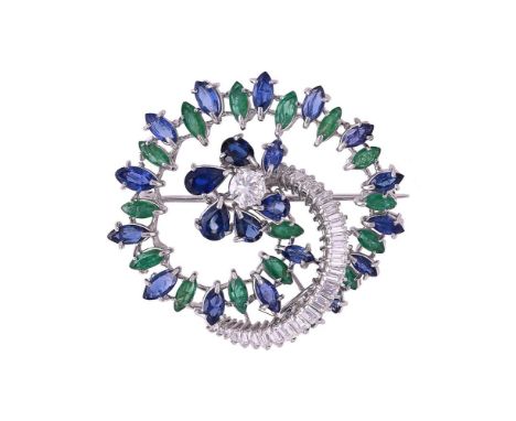 A DIAMOND, EMERALD AND SAPPHIRE CIRCLE BROOCH The hooped floral brooch with a spiral of alternating marquise cut sapphires an