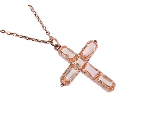 A GEORGIAN TOPAZ CROSS PENDANT CIRCA 1810The facetted topaz arms in gold cut down collet settings, with a polished loop bale,