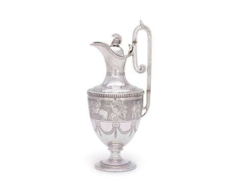 Y A CASED VICTORIAN SILVER EWERMARTIN, HALL & CO., LONDON 1877With a Greek helmet finial, the high clip handle with ivory war