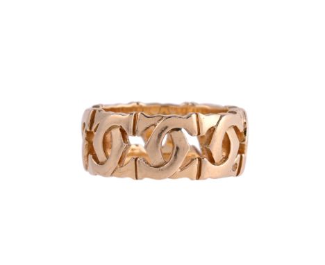 CARTIER, DOUBLE C BAND RINGThe pierced ring with polished interlocking double C's, the interior signed Cartier and stamped 53