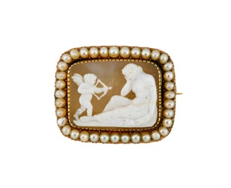 A LATE 19TH CENTURY HARDSTONE CAMEO IN ASSOCIATED HALF PEARL SETTINGThe hardstone panel carved with Eros (Cupid) aiming his b