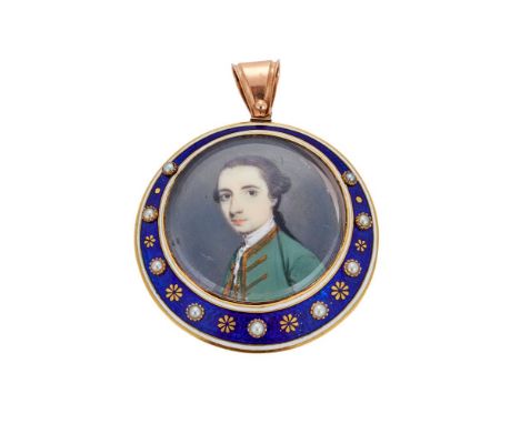 Y A GEORGE III LOCKET PENDANT CIRCA 1790The circular panel with a graduated border of blue enamel and white enamelled borders