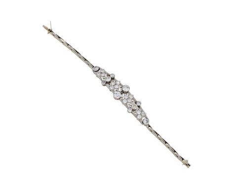 AN EDWARDIAN DIAMOND BRACELET CIRCA 1910The pierced foliate panel set with graduated old cut diamonds in millegrained setting