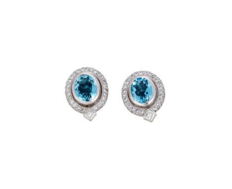 STEPHEN WEBSTER, A PAIR OF AQUAMARINE AND DIAMOND CLUSTER EARRINGS LONDON 1997The central oval cut aquamarines within pavé se