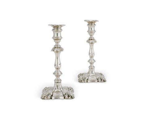 A PAIR OF WILLIAM IV SILVER CANDLESTICKSHENRY WILKINSON & CO., SHEFFIELD 1835The shaped square scones with shells to the corn