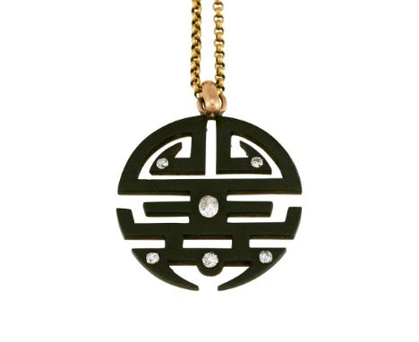 A MID 20TH CENTURY DIAMOND AND OXIDISED METAL SHOU PENDANTThe pierced circular pendant in the form of the character shou, ins