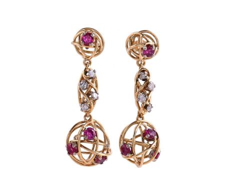 A PAIR OF 1970S ABSTRACT RUBY AND DIAMOND EAR PENDANTSThe hooped gold coloured wire orbs with claw set circular cut ruby acce