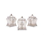 A SET OF THREE GEORGE III SILVER TEA CADDIES
