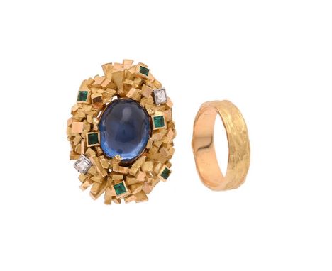 ATTRIBUTED TO ANDREW GRIMA, A SAPPHIRE, DIAMOND AND EMERALD DRESS RINGThe central oval cabochon sapphire within an undulating