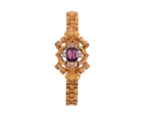 A FRENCH MID 19TH CENTURY GOLD, GARNET AND DIAMOND BRACELET  CIRCA 1860The pierced central quatrefoil panel with engraved scr