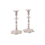 A PAIR OF GEORGE II CAST SILVER CANDLESTICKS