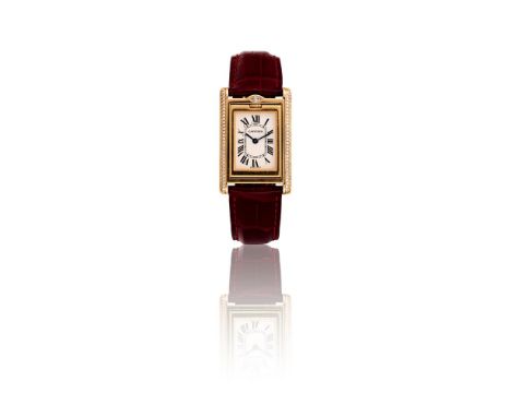 Y CARTIER, TANK BASCULANTE, REF. 2506A LADY'S 18 CARAT GOLD AND DIAMOND REVERSIBLE WRIST WATCH, NO. 345722MG, CIRCA 2003Movem