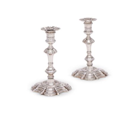 A MATCHED PAIR OF GEORGE II CAST SILVER CANDLESTICKSPOSSIBLY JOHN LUFF, LONDON 1750 AND WILLIAM GOULD, LONDON 1750With shaped