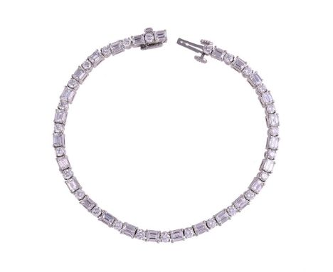 PICCHIOTTI, A DIAMOND LINE BRACELETThe bracelet with alternating step cut diamonds with canted corners and brilliant cut diam