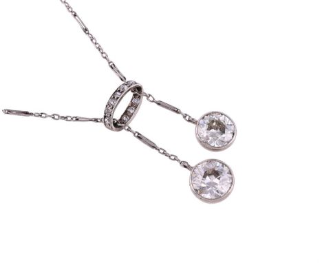 AN EDWARDIAN DIAMOND NÉGLIGÉE NECKLACE CIRCA 1910The two old European cut diamonds in collet settings, estimated to weigh 1.2