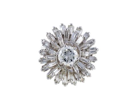 A DIAMOND CLUSTER DRESS RINGThe central diamond estimated to weigh 0.85 carats, within a swirling surround of baguette cut di