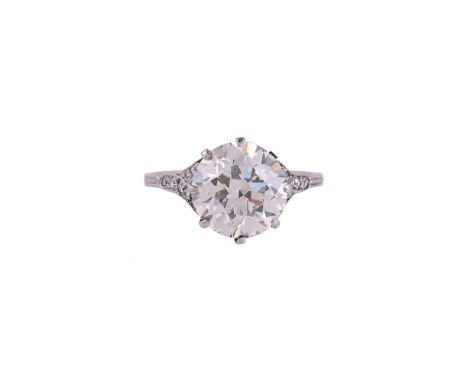 A SINGLE STONE DIAMOND RING The old European cut diamond weighing 3.55 carats, within a pierced scrolled heart gallery, to bi