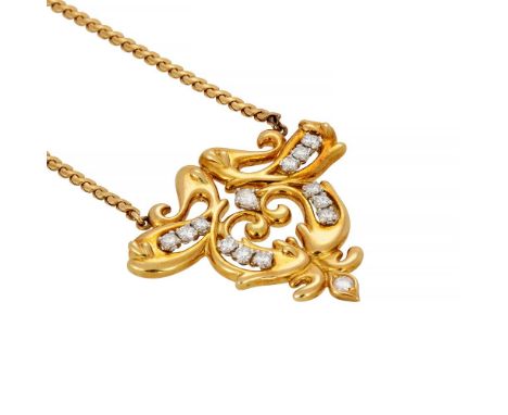CARTIER, A DIAMOND PENDANTCIRCA 1976The pierced scrolling pendant with brilliant cut diamond accents, approximately 0.78 cara