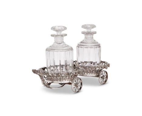 AN ELECTRO-PLATED DECANTER CARRIAGEUNMARKEDThe wirework bodies with cast grape vine borders, wooden bases, a grape vine loop 