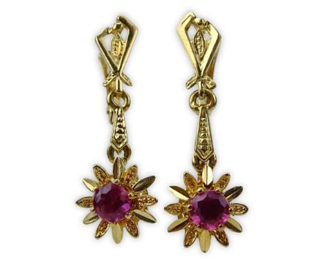 Pair of Vintage European 18 Karat Yellow Gold and Round Cut Ruby Earrings. Signed MM 18KT. Rubies with vivid saturation of co