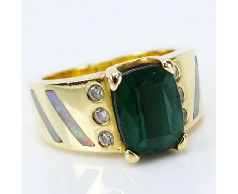 Green Tourmaline and 18 Karat Yellow Gold Ring with Small Round Cut Diamond and Opal accents. Tourmaline measures 10mm x 7.5m