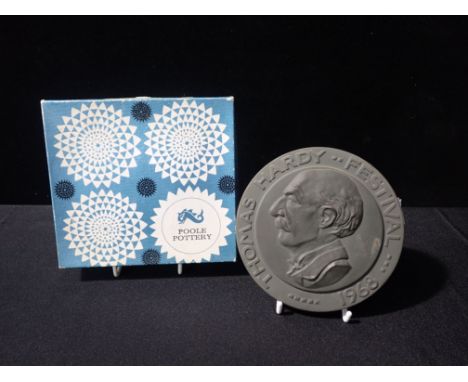 A POOLE POTTERY HARDY FESTIVAL PLAQUE 1968, no. 256, in original box 14.5cm diam