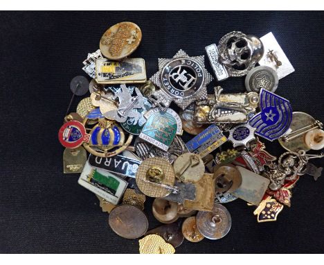 A COLLECTION OF ENAMEL BADGES and other items