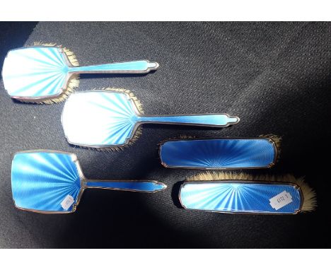 A SILVER AND ENAMEL DRESSING TABLE BRUSH SET minor enamel loss to mirror and a few dents to silver