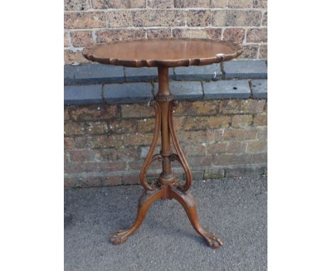 A CHIPPENDALE REVIVAL 'PIECRUST' TOP TABLE with elaborately carved tripod base, and scrolling supports from the column to the