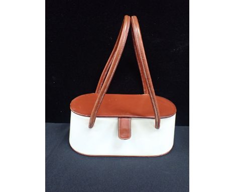 A VINTAGE THEODOR, CALIFORNIA PURSE/HANDBAG two-tone leather, oval box form with interior lid mirror, and double handle 25cm 