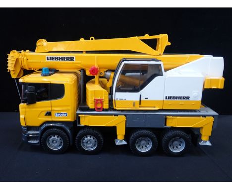 BRUDER SCANIA R-SERIES LIEBHERR CRANE TRUCKS features tool compartment, folding mirrors, drivers cab with realistic lights an