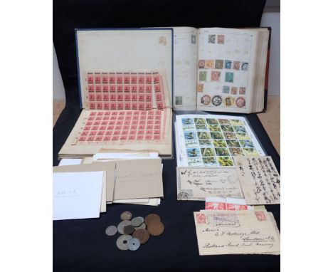 TWO STAMP ALBUMS partially filled with international stamps, once including a sheet of German 2 Million Mark stamps, together