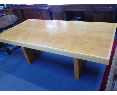 A HEAL'S MODERN LIGHT OAK AND BURR VENEERED DINING TABLE with recessed slab supports 100 x 200cm (some wear and knocks)