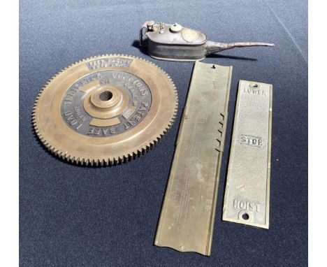 A BREAD MAKER'S TEMPERATURE GAUGE with a vintage George Hatch oil can and and crane jib safe load indicator and a crane contr