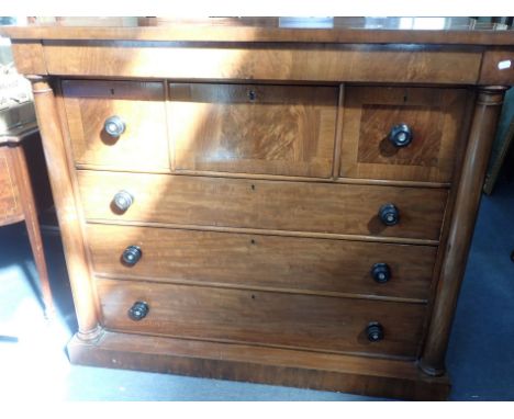 A VICTORIAN MAHOGANY SCOTCH' CHEST OF DRAWERS three deep drawers over three long drawers, flanked by columns, with frieze dra