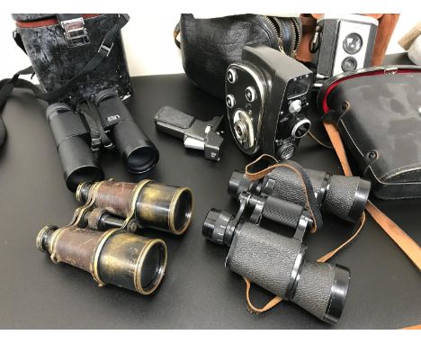 A Lot of vintage cameras and Binoculars which includes Quartz Cine camera with carry bag, Nikon binoculars and French field b