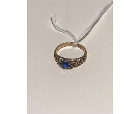 A 9ct gold ladies ring set with a blue sapphire. 