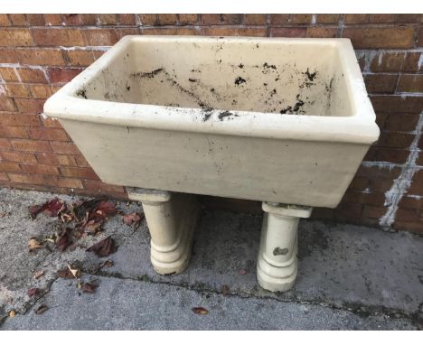 A large Victorian ceramic sink and pedestals 