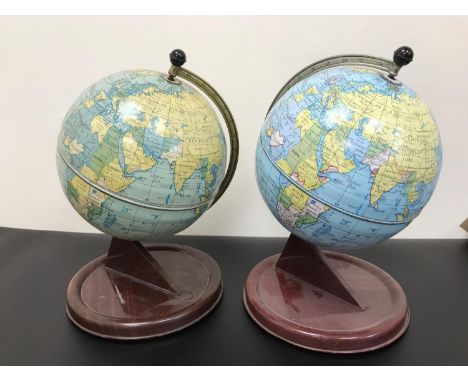 2 Vintage Chad Valley tin desk globes. Measure 28cm in height. 