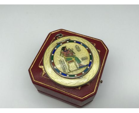 A 1920s Silver and enamel Egyptian revival compact pendant, fitted with a mirror to the inside. 