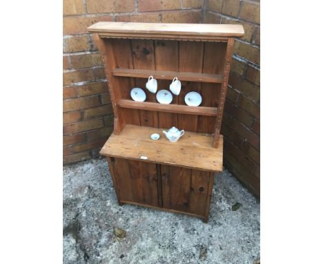 Antique child’s pine dresser with tea for two ceramic set. 